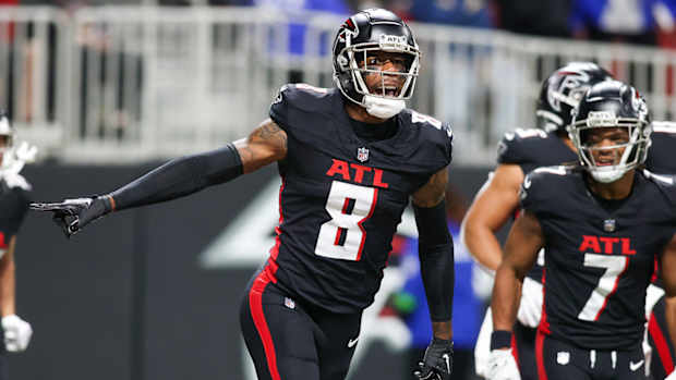 Falcons tight end Kyle Pitts (8) celebrates after a touchdown against the Tampa Bay Buccaneers in the first half at Mercedes-Benz Stadium.